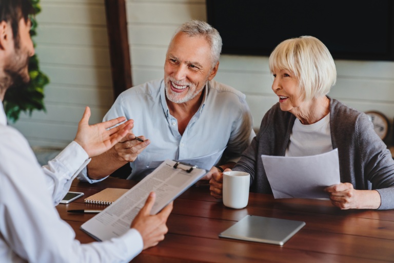couple consulting with insurance agent